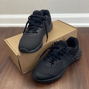All black Nike sneakers